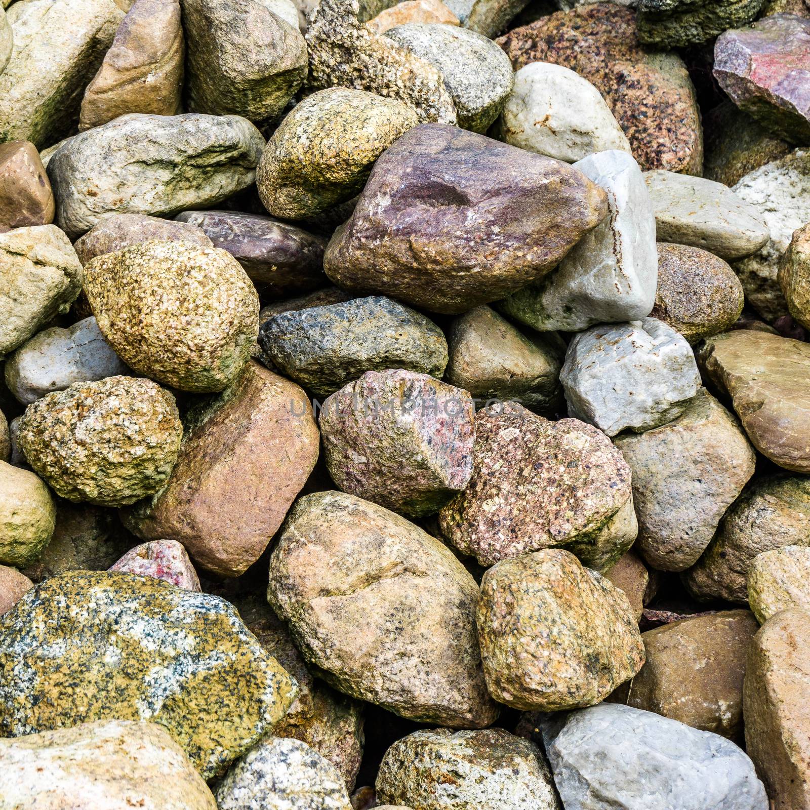 Stones and boulders from Scandinavia on a big pile, background or wallpaper