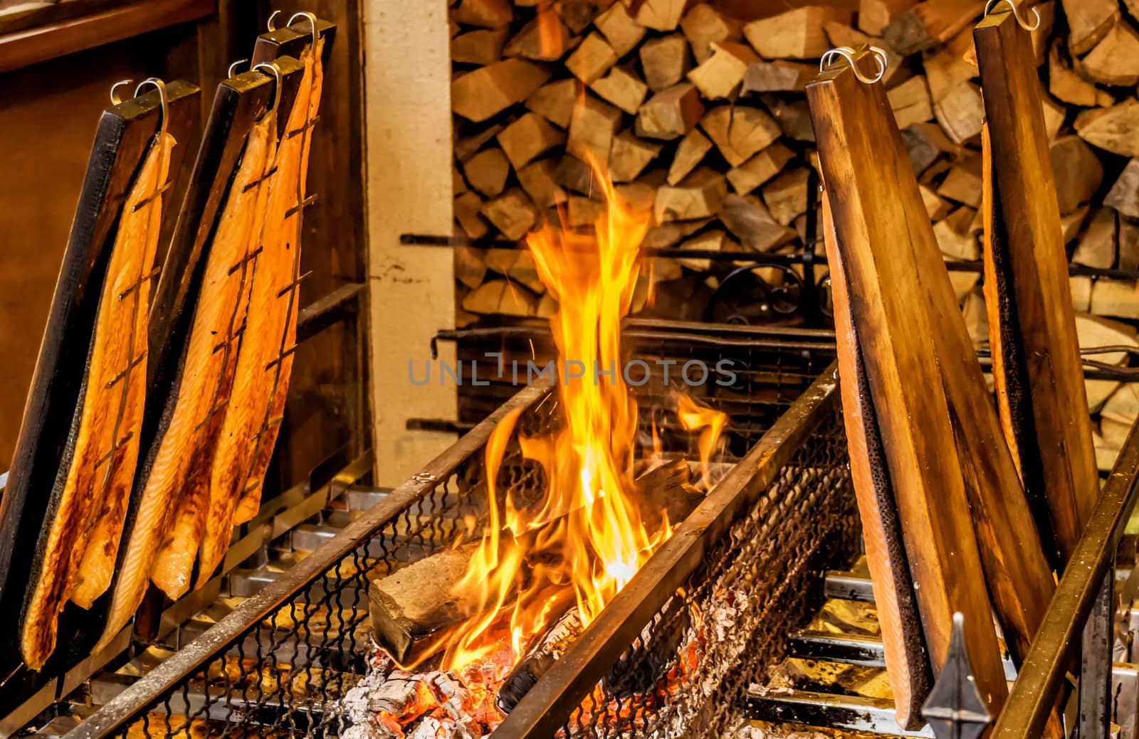 Flame salmon at a Christmas market in Germany by geogif