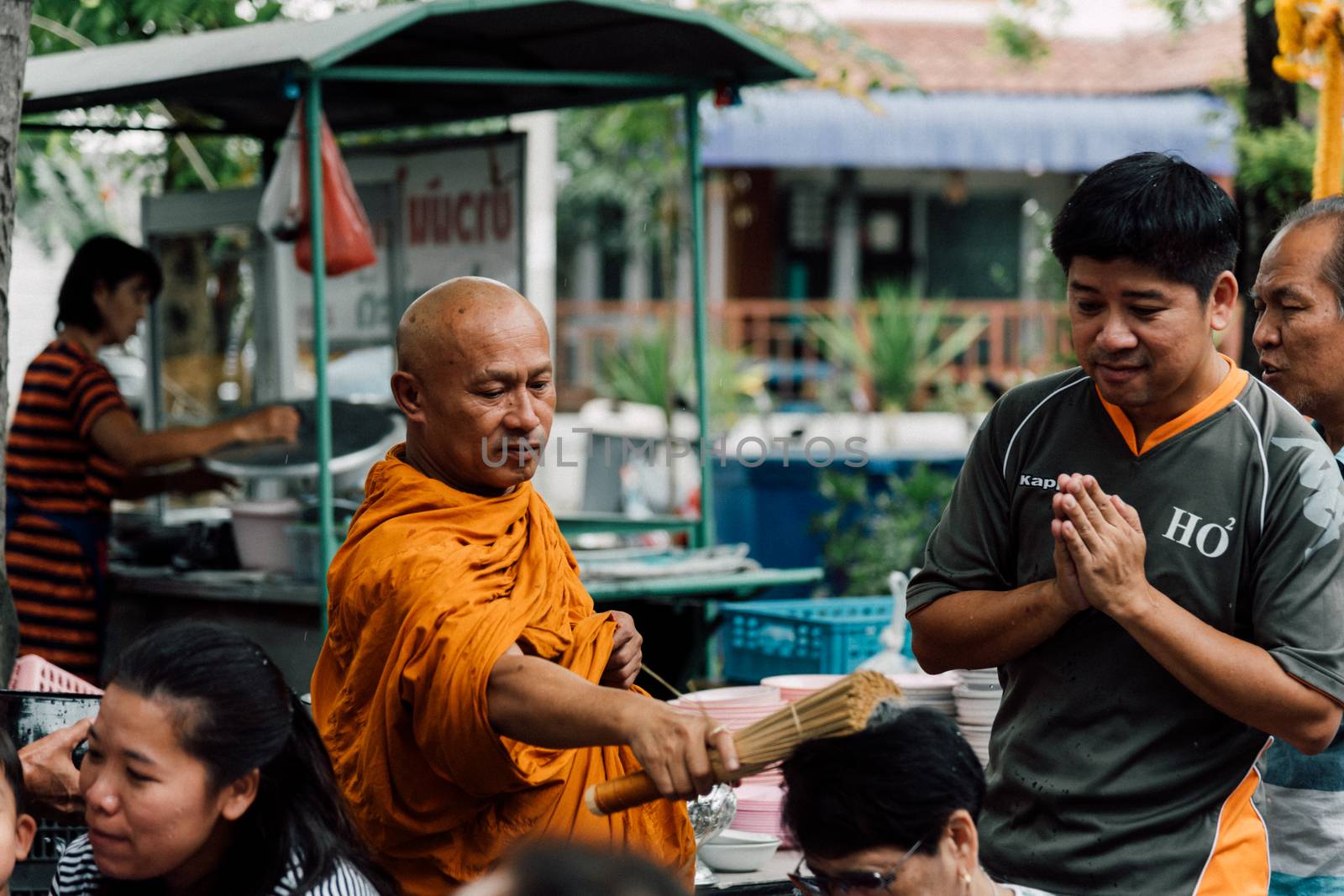 Bangkok, Thailand - April 29, 2018 : Unidentified thai monk praying and bless by holy water for religious ceremony in buddhist belief at Thai temple (Wat Thai)