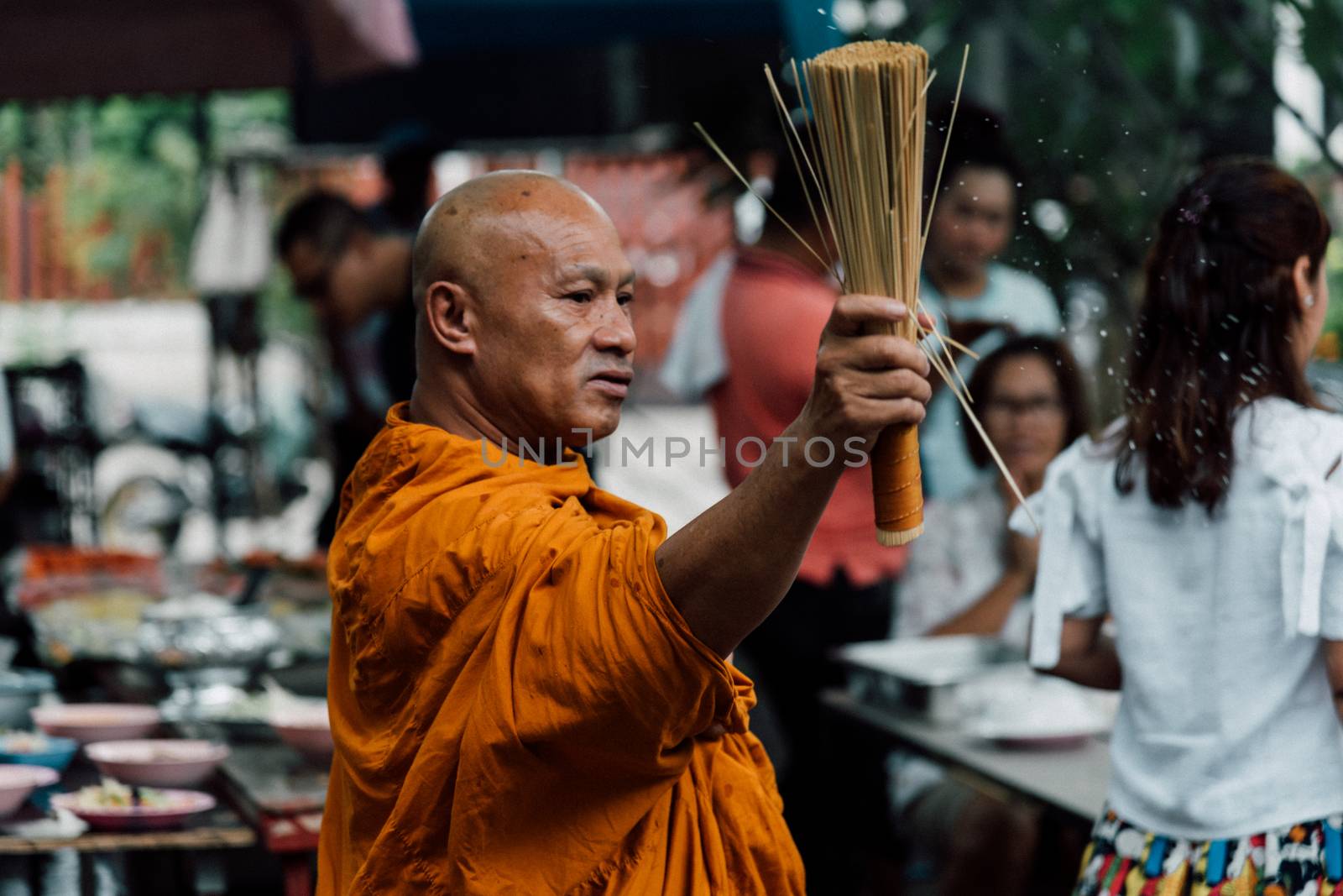 Bangkok, Thailand - April 29, 2018 : Unidentified thai monk praying and bless by holy water for religious ceremony in buddhist belief at Thai temple (Wat Thai)