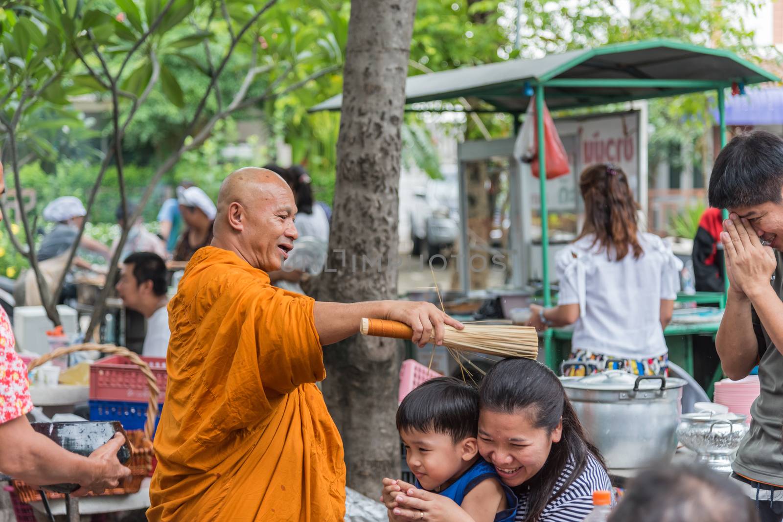 Bangkok, Thailand - April 29, 2018 : Unidentified thai monk praying and bless by holy water for religious ceremony in buddhist belief at Thai temple (Wat Thai)