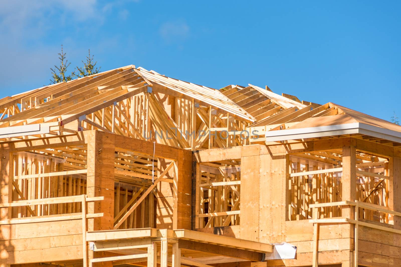 New apartment building under construction on sunny day on blue sky background