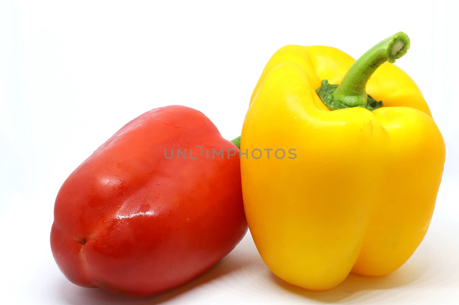 red and yellow bell pepper by Nawoot