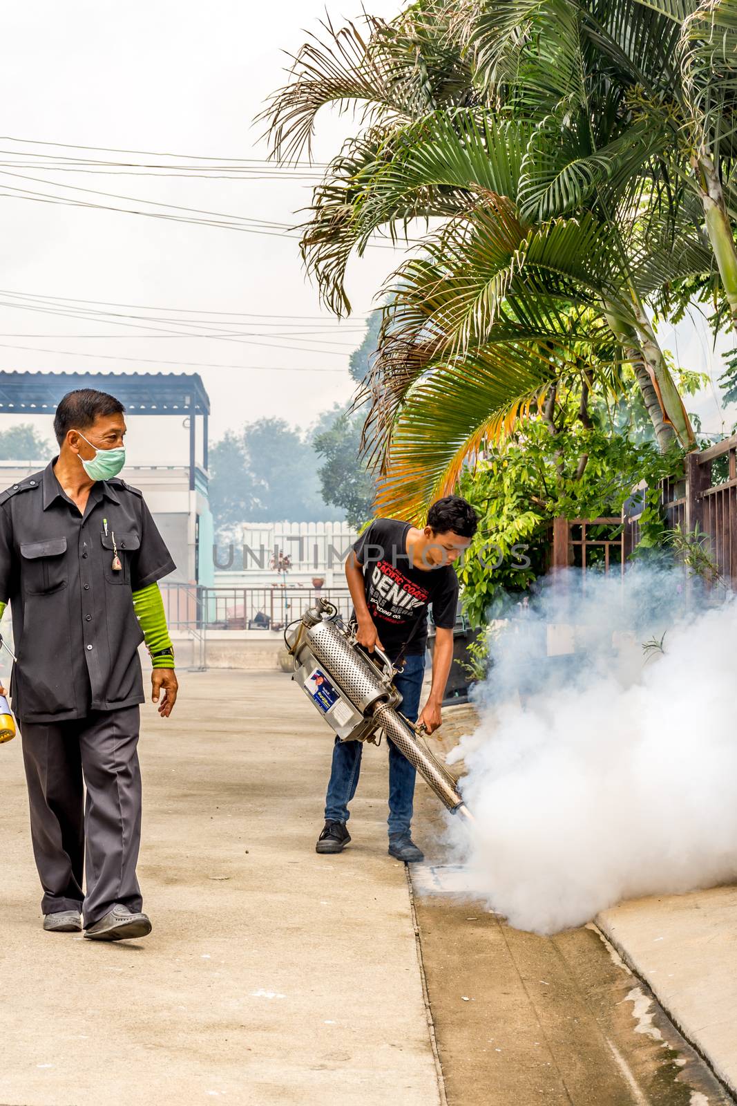 Bangkok, Thailand - July 3, 2016 : Unidentified people fogging DDT spray kill mosquito for control Malaria, Encephalitis, Dengue and Zika in village at Bangkok Thailand.