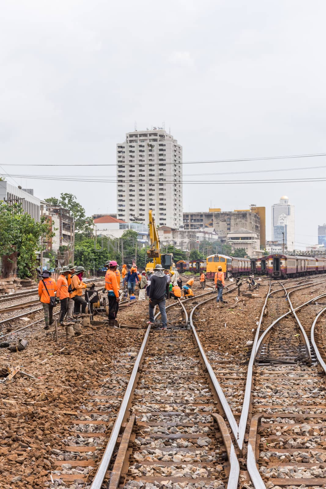Bangkok, Thailand - August 11, 2016 : Unidentified railway employees working for restoration the railroad tracks in Bangkok station before serving at State Railway of Thailand.