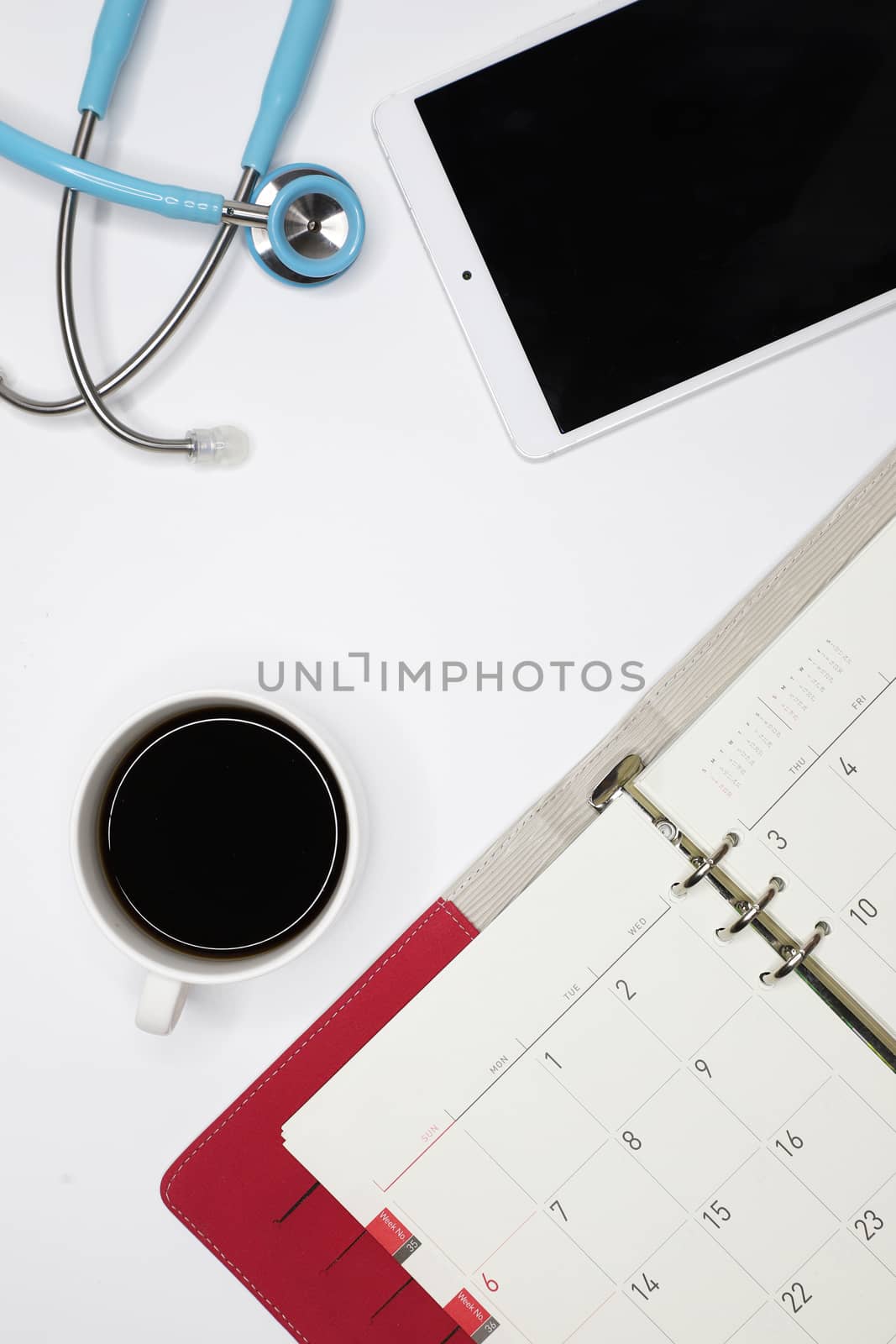 a doctor's appointment book, a tablet, and a stethoscope by Nawoot