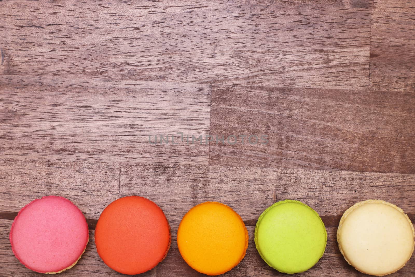 colorful macaroons on a wooden top table