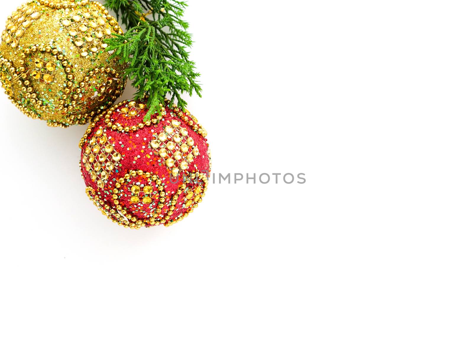red and gold Christmas balls with glittering golden beads and glasses, isolated on white background