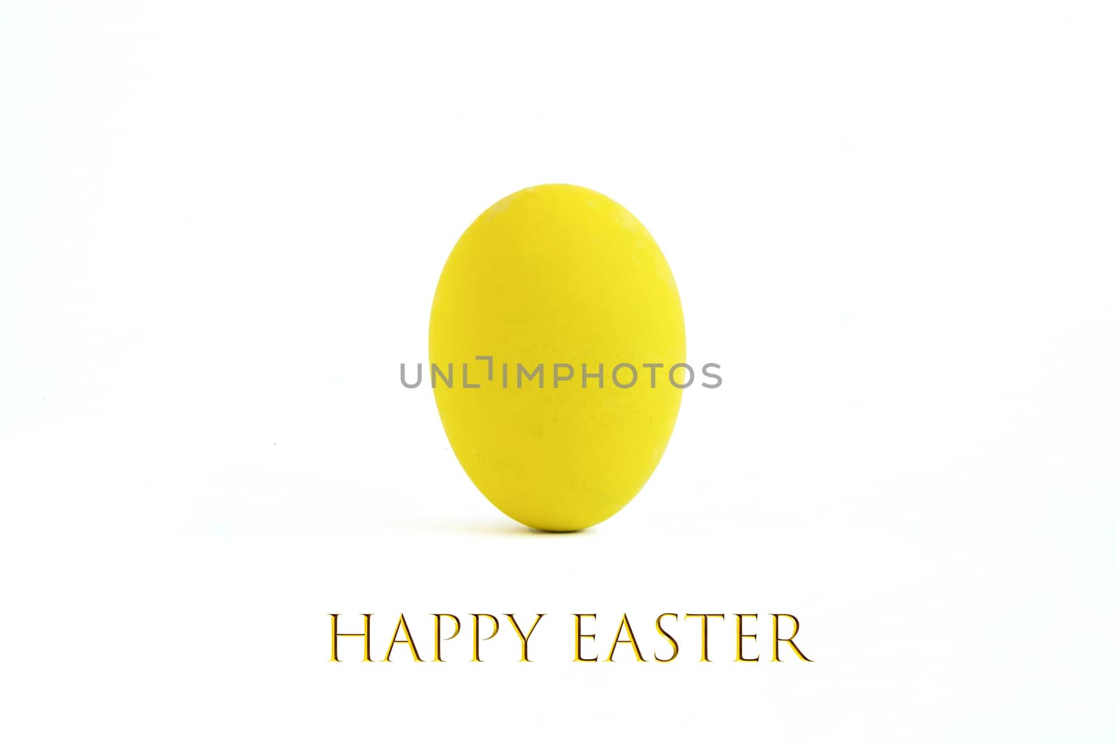 An easter egg painted with yellow color, isolated on white background