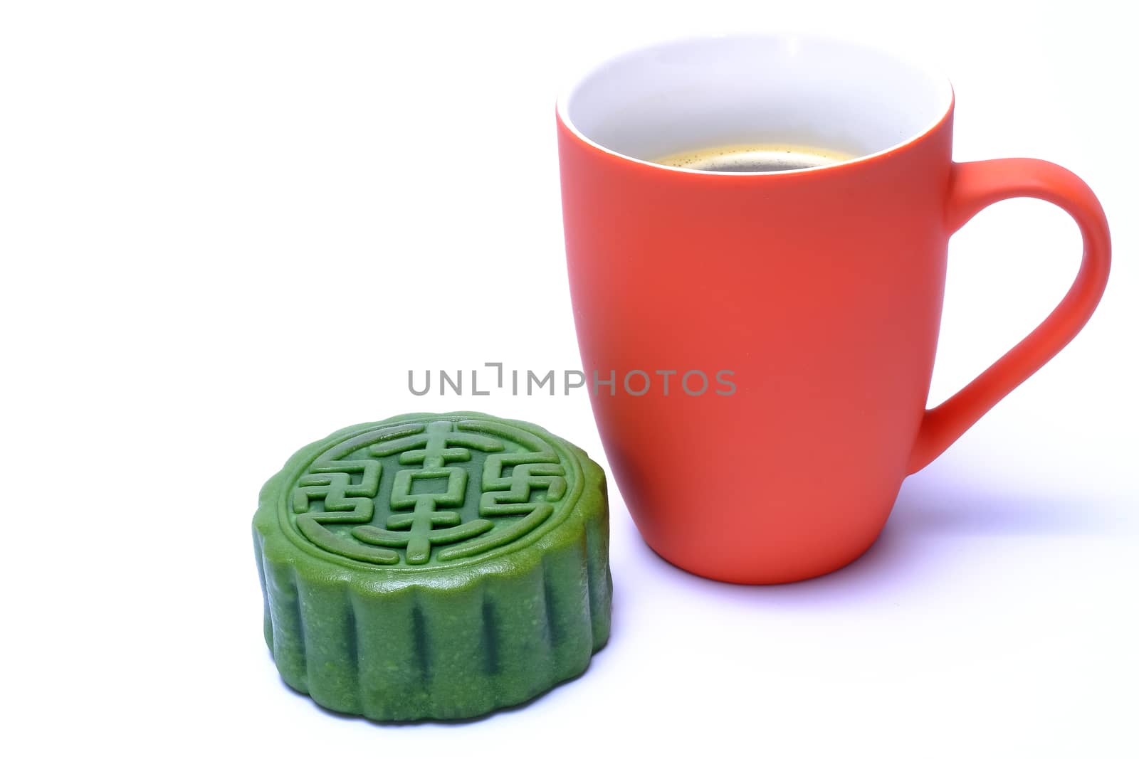 green tea flavor moon-cake and a mug of hot coffee isolated on white background