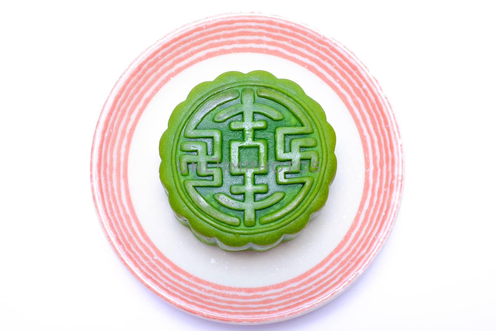 chinese traditional pastry on a white ceramic plate, with non-traditional green tea flavor