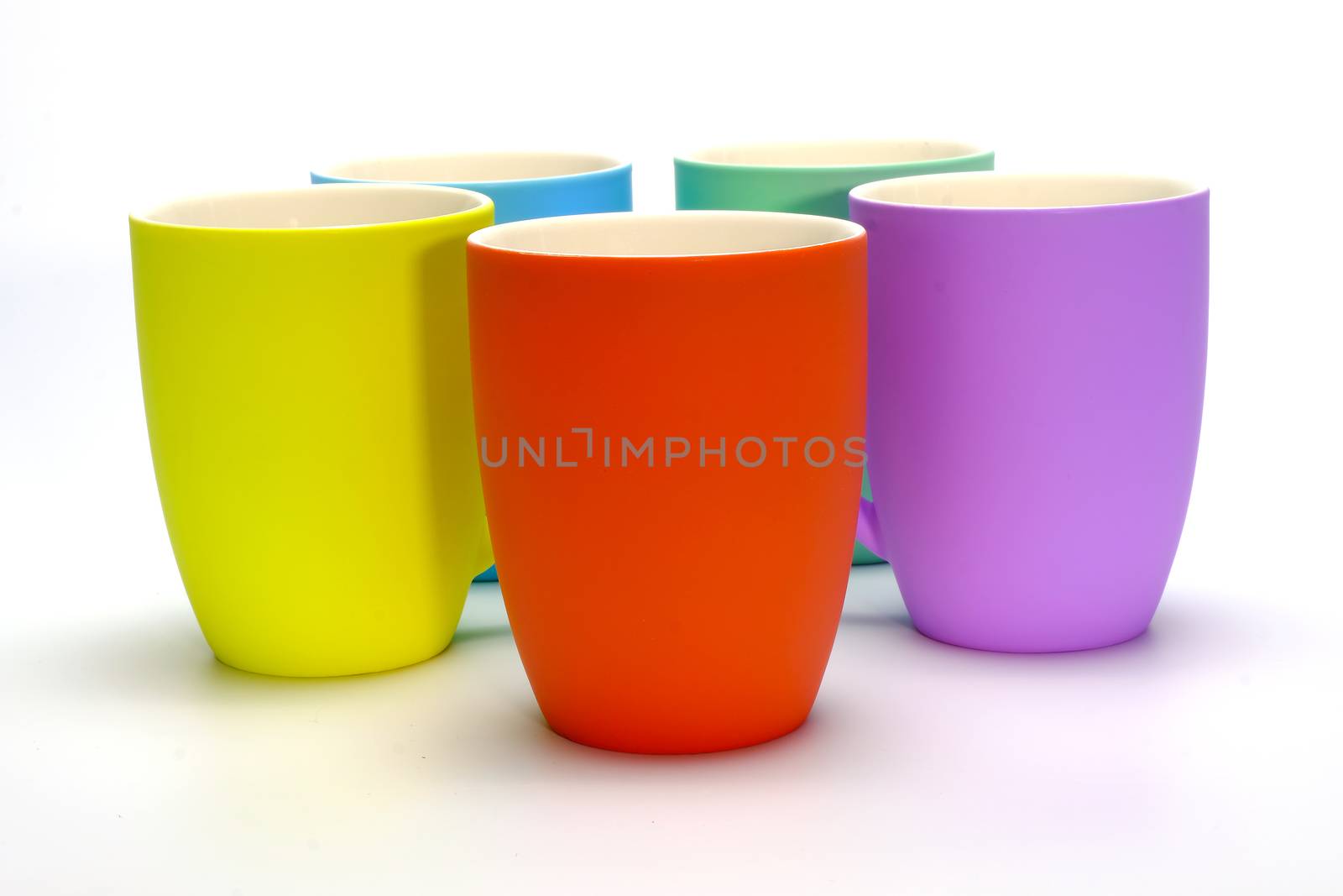 olorful coffee mugs isolated on white background