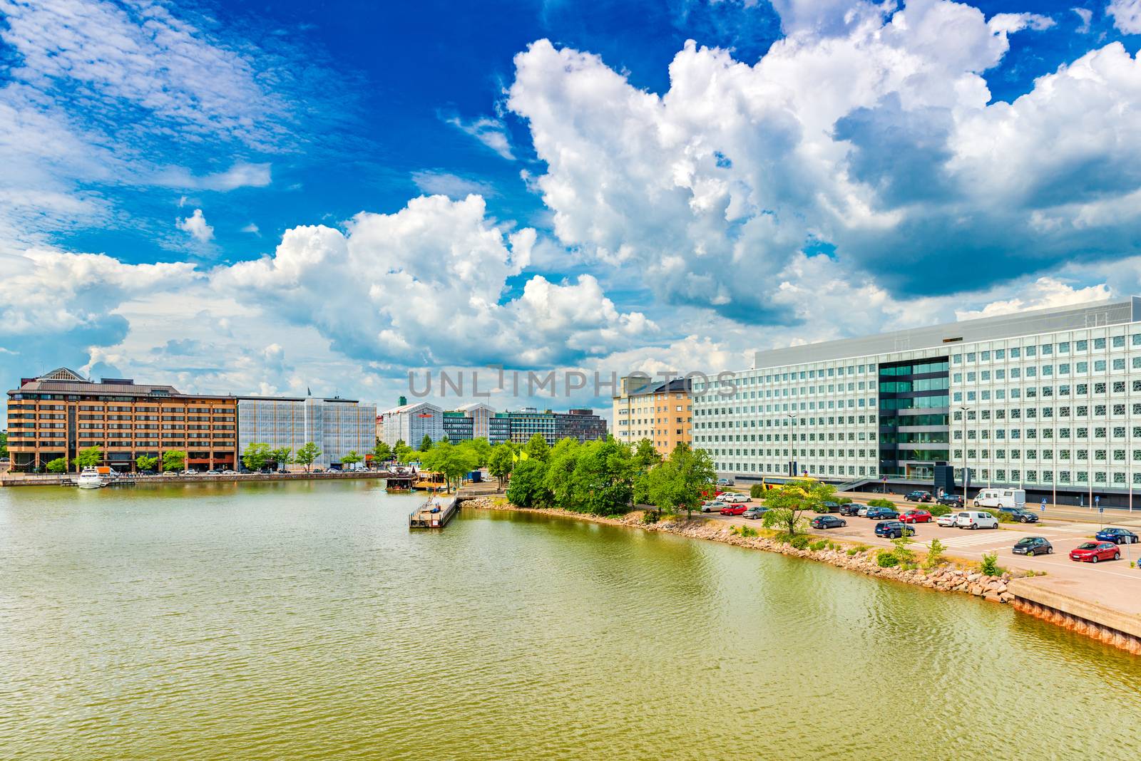 Modern buildings in the central part of Helsinki, Finland. Picturesque clouds and the blue sky over a modern quarter