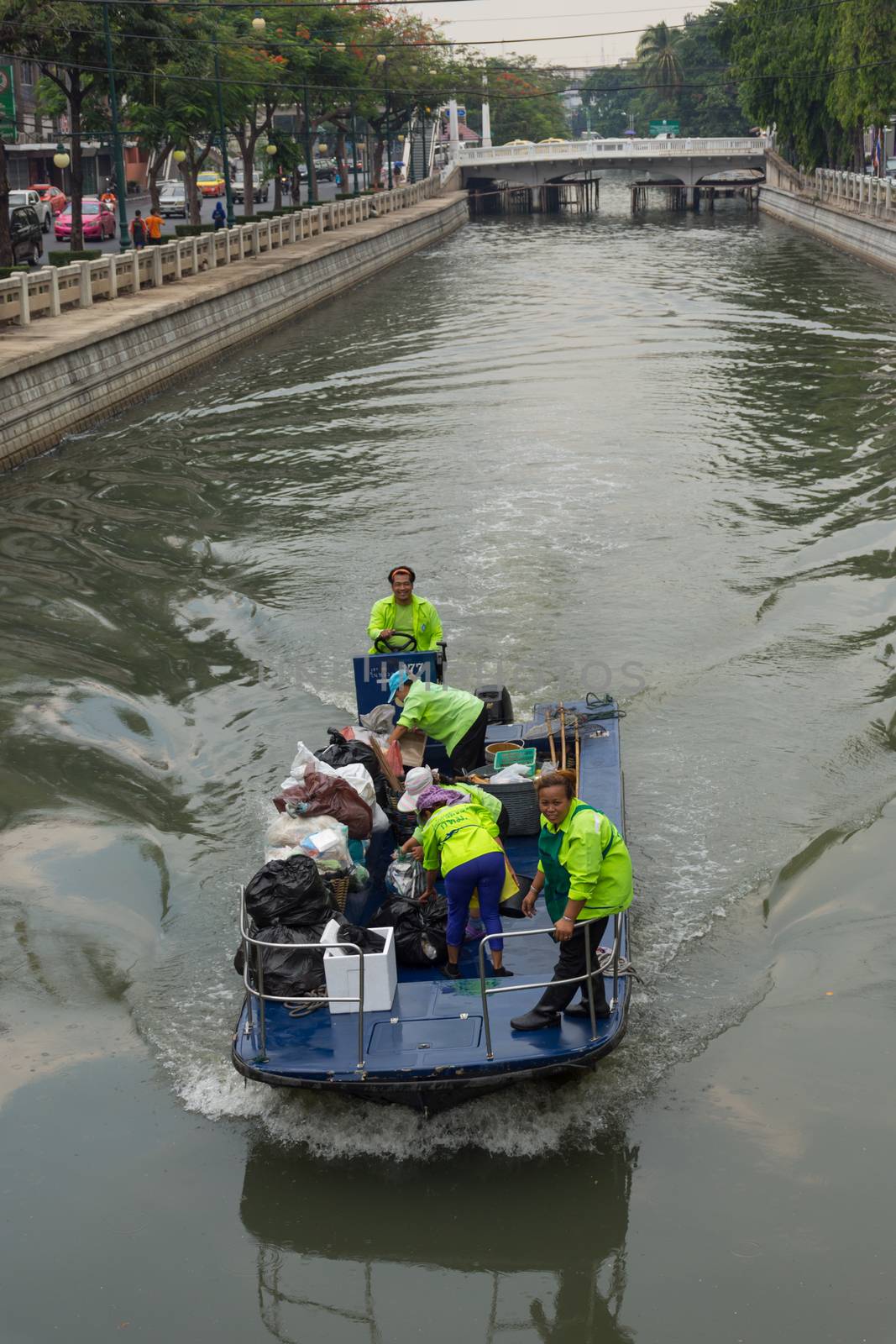 Bangkok, Thailand - May 16, 2016 : Garbage collection boat working in Khlong Phadung Krungkasem is a important canal in downtown Bangkok, Thailand.