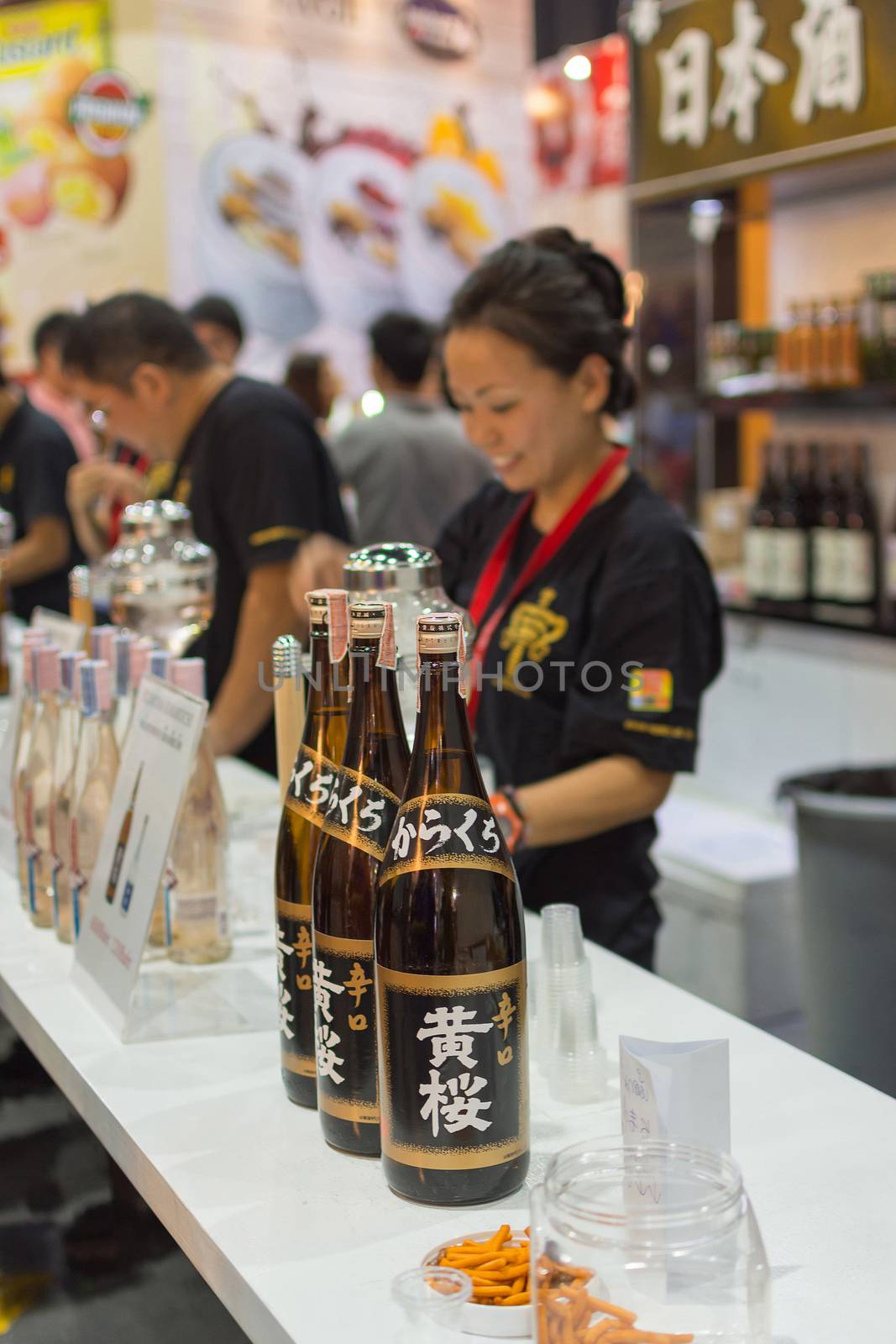 Bangkok, Thailand - May 28, 2016 : Barman or bartender of japan liquor at the bar. Japan liquor is a type of distilled alcoholic beverage made from fermented grain mash.