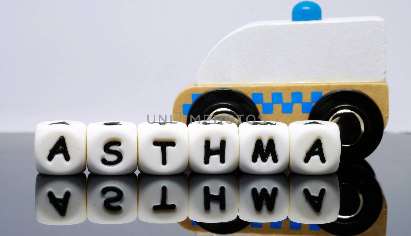 alphabet letters spelling a word asthma, a condition demands urgent medical treatment