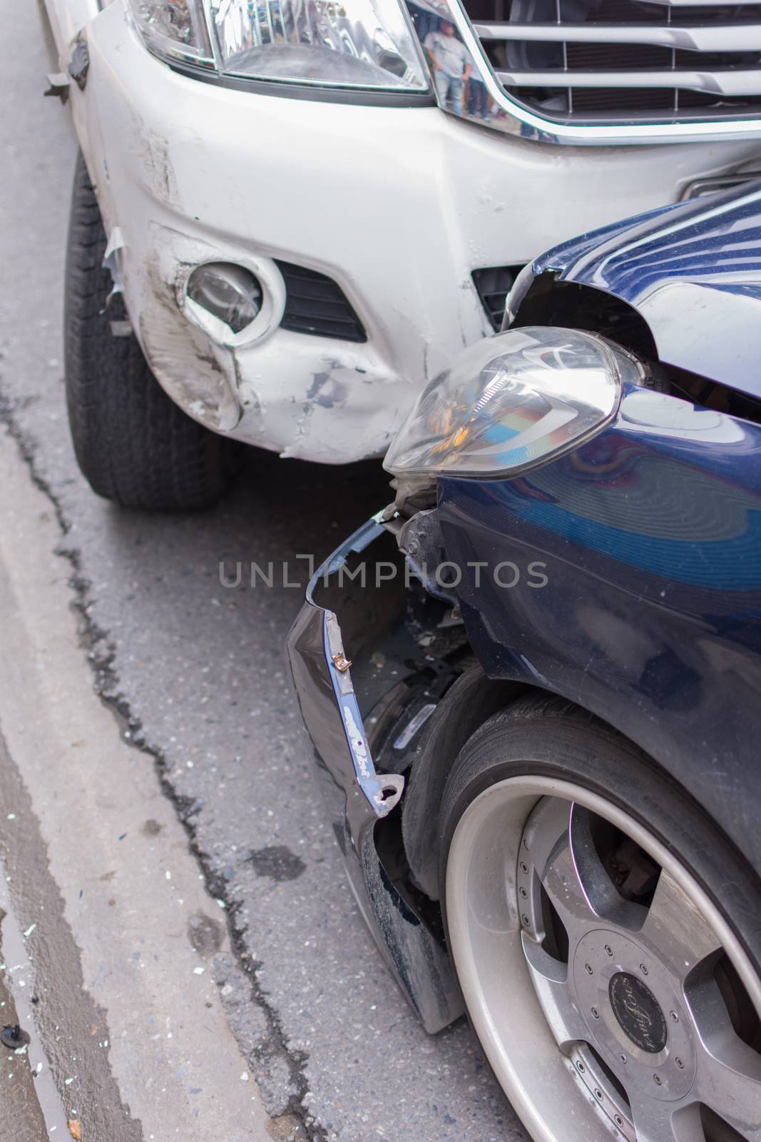 Bangkok, Thailand - June 17, 2016 : Car crash from car accident on the road in a city between saloon versus pickup wait insurance.