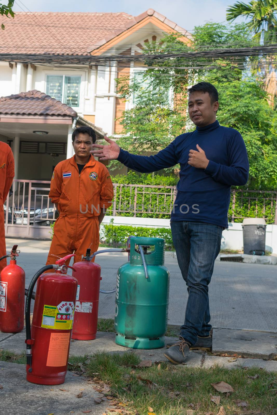 Bangkok, Thailand - January 31, 2016 : Many people preparedness for fire drill and training to use a fire safety tank in village at Bangkok Thailand.