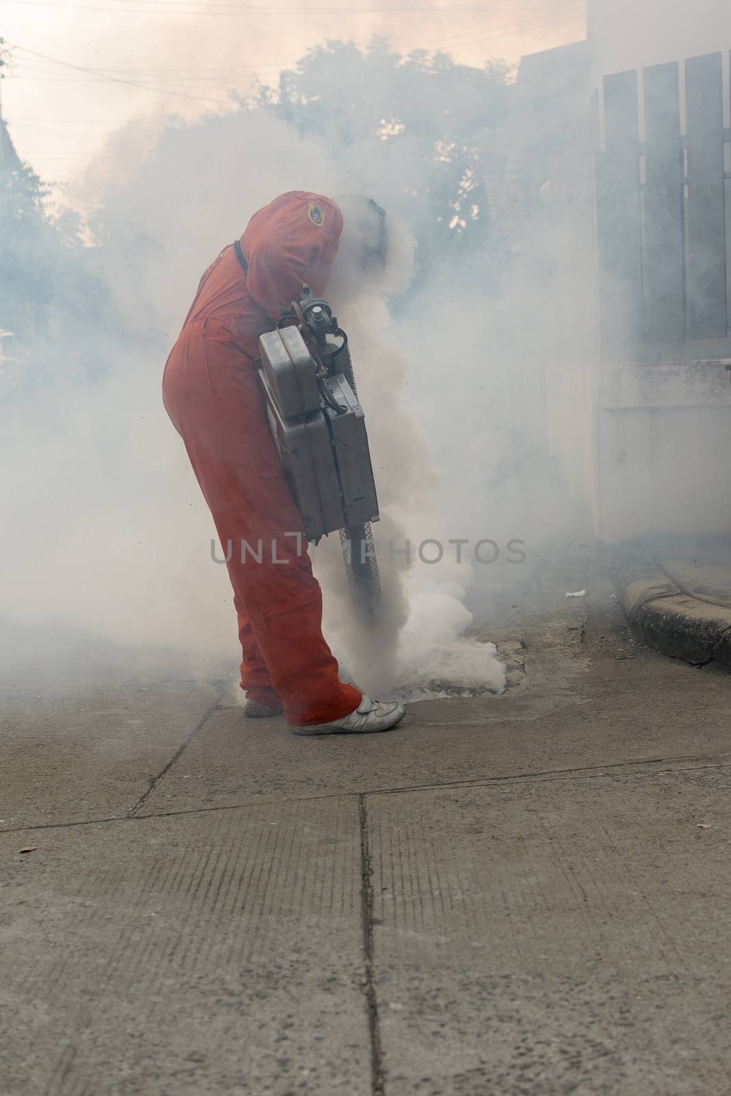 Bangkok, Thailand - January 31, 2016 : Unidentified people fogging DDT spray kill mosquito for control Malaria, Encephalitis, Dengue and Zika in village at Bangkok Thailand.