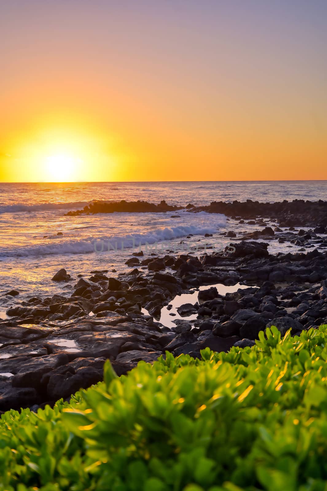 Sunset over the coast of Kauai, Hawaii.