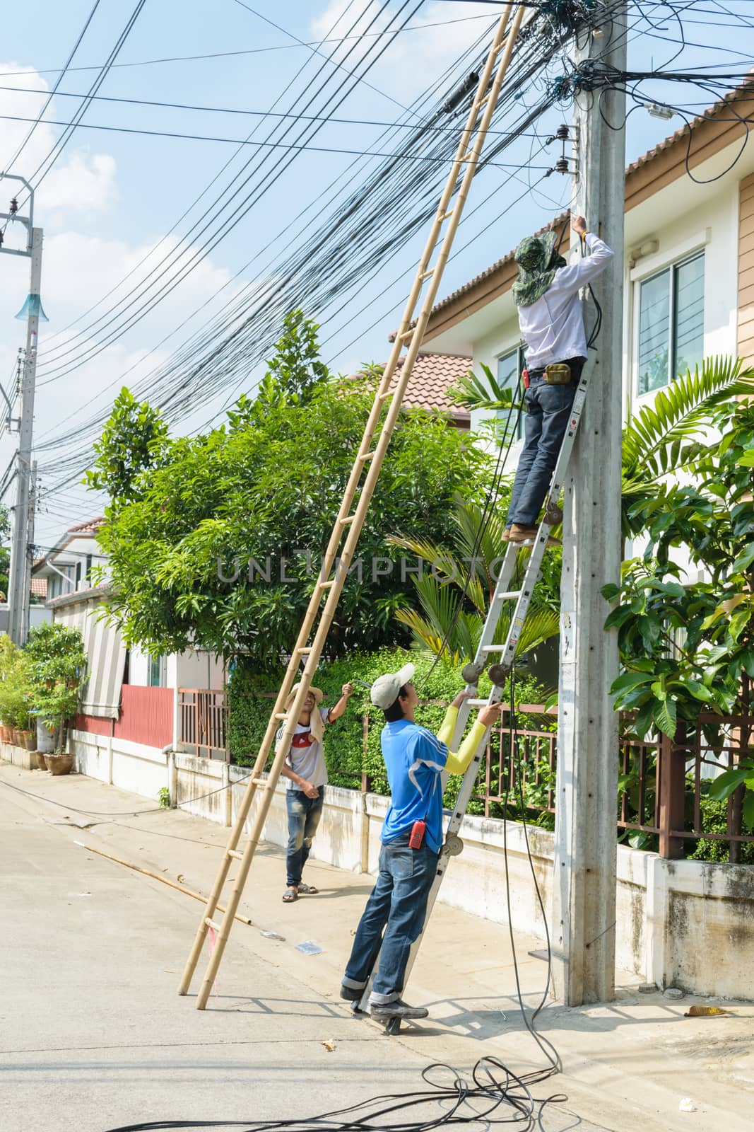 Bangkok, Thailand - October 17, 2015 : Unidentified worker working to install CCTV system in village at Bangkok Thailand.