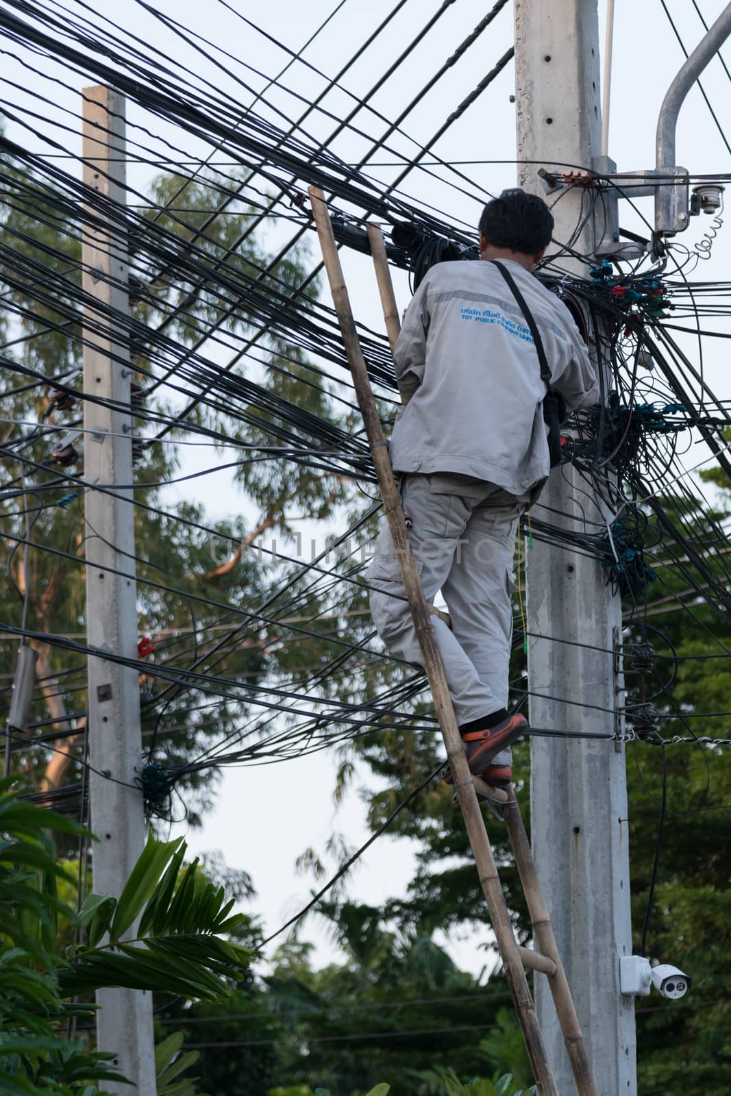 Bangkok, Thailand - November 16, 2015 : Unidentified worker working to install internet fiber system in village at Bangkok Thailand.