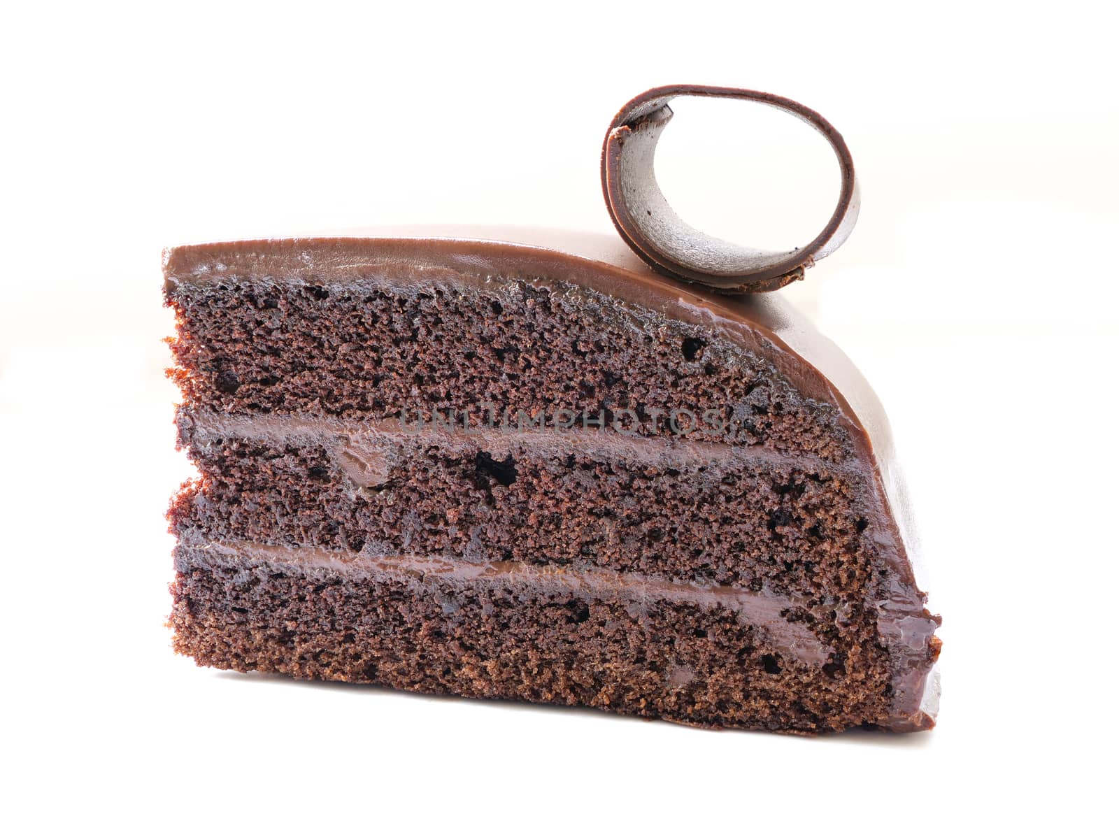 a piece of chocolate cake with fudge, isolated on white background