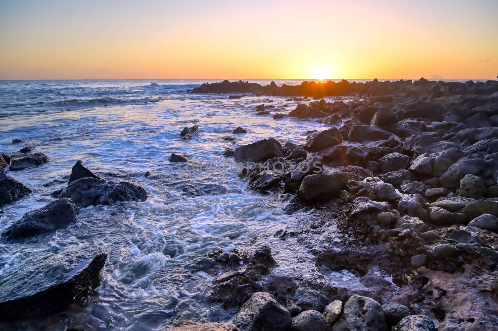 Sunset over the coast of Kauai, Hawaii.