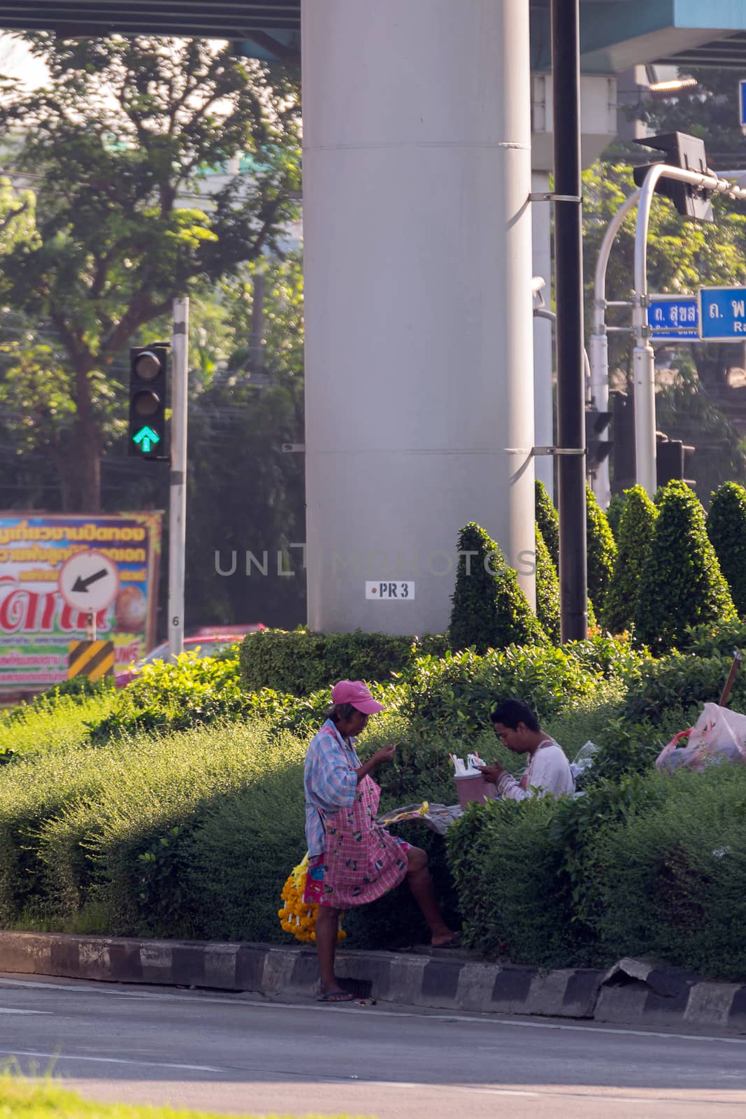 Bangkok, Thailand - November 21, 2015 : Unidentified asian people garland flower selling on road in Bangkok, Thailand.