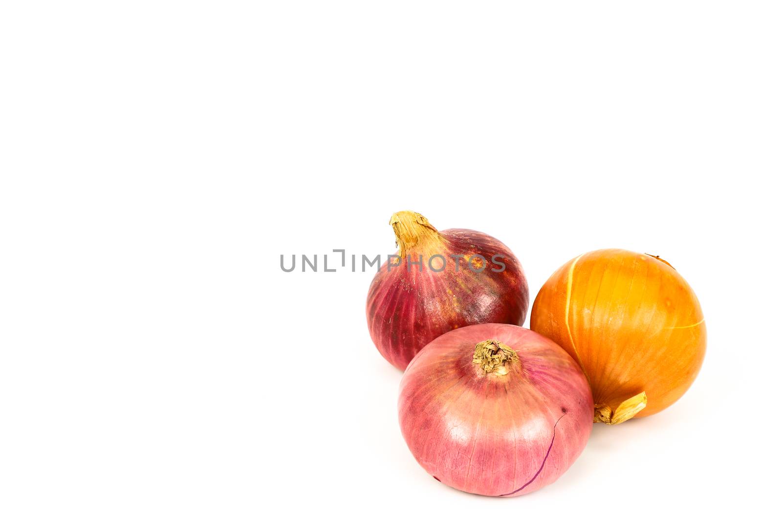 Top view of fresh, pesticide free, organic onions isolated on white background