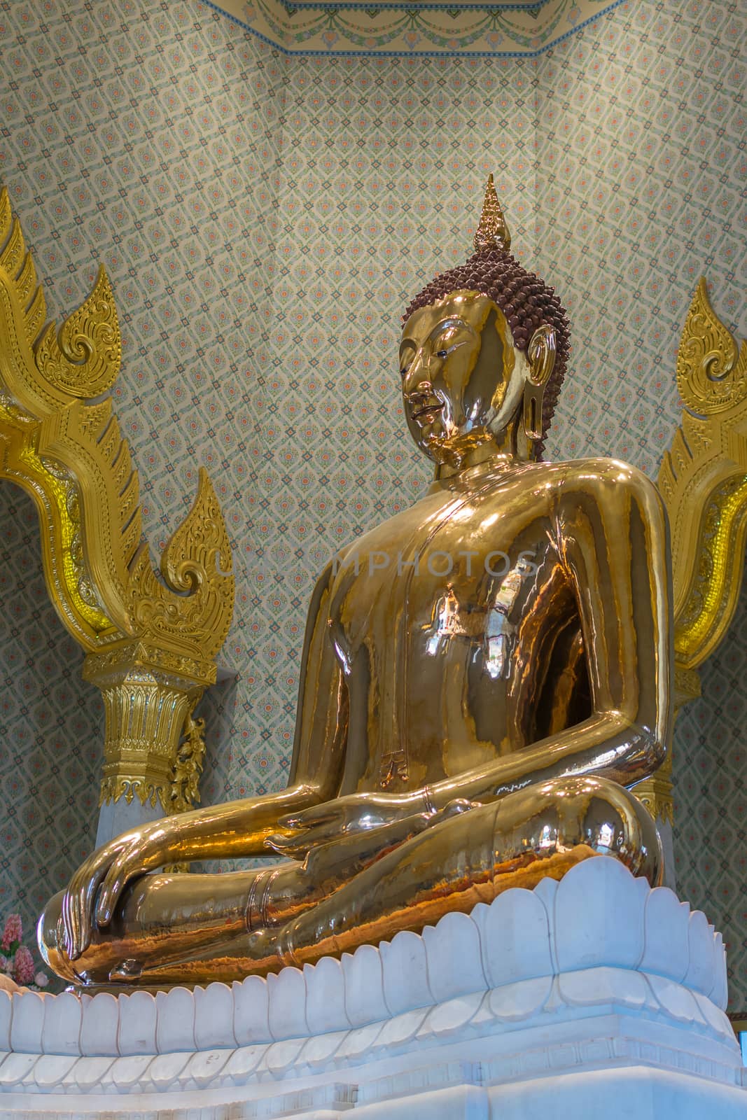 Bangkok, Thailand - March 11, 2016 : Thai buddha statue at Wat Traimitr Withayaram is a important Thai temple in Chinatown Bangkok, Thailand.