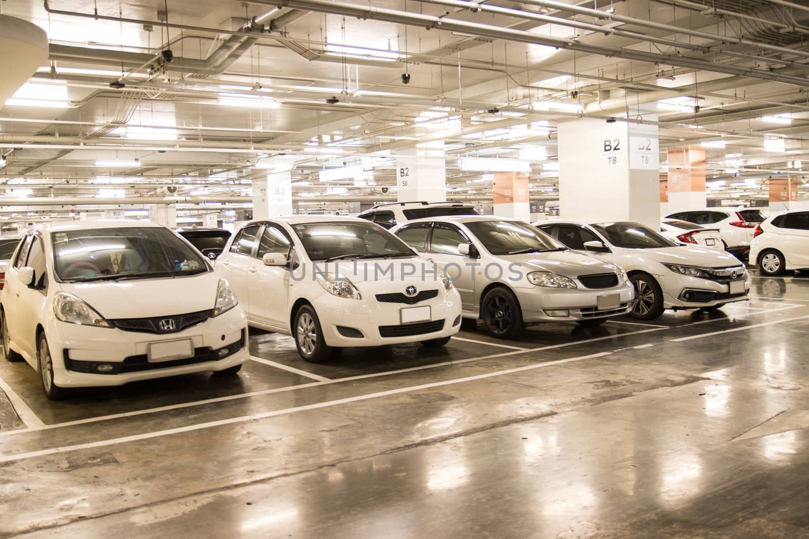 Bangkok Thailand :- june 6, 2020: Parking lot in the building with Orderly park the car along the dividing line 
