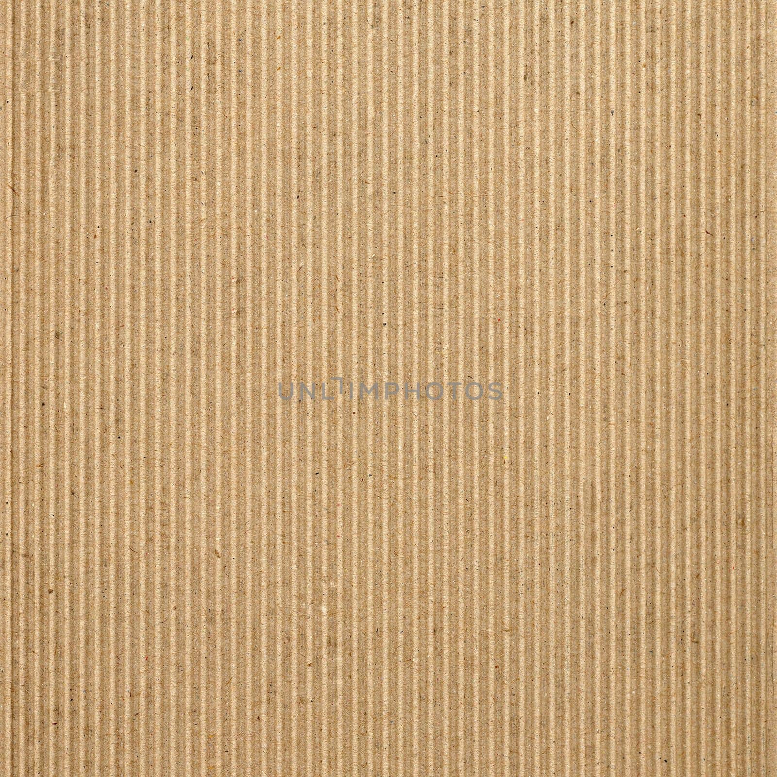 Brown corrugated cardboard texture background by claudiodivizia