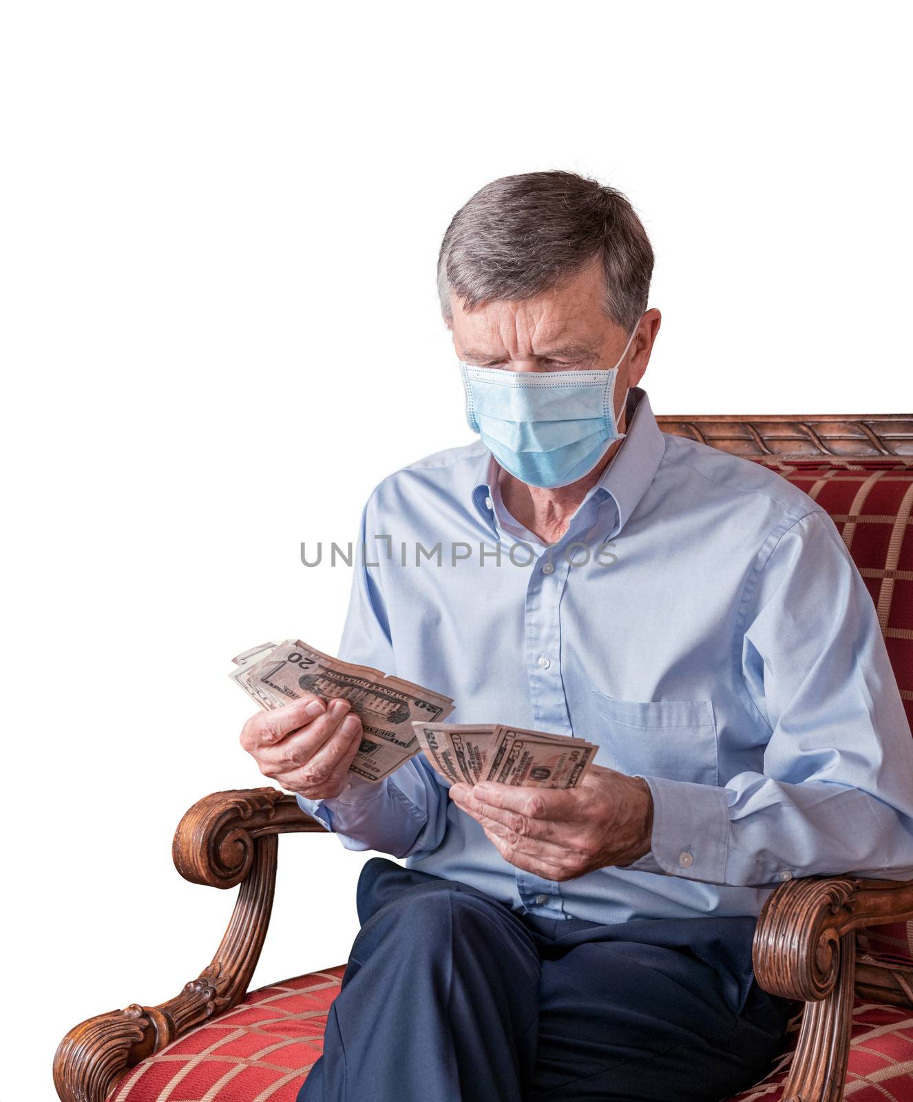 Senior man counting out US dollar bills with face mask and looking worried by steheap