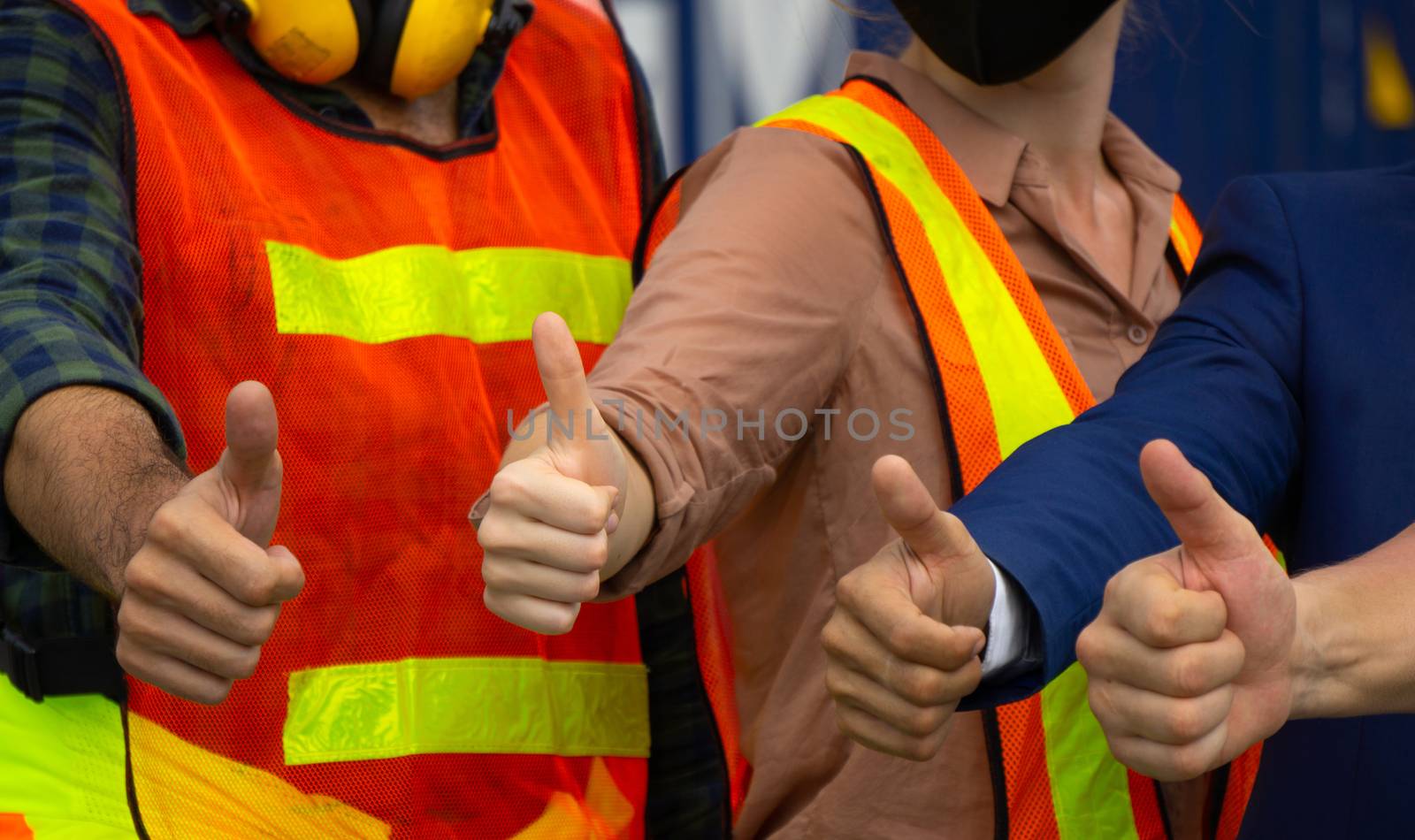Industrial workers or engineers Thumbs up by pkproject
