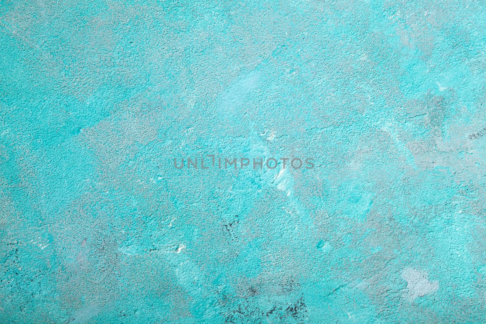 Concrete emerald green background with scuffs and black splashes. Textured wall texture in the grunge style.