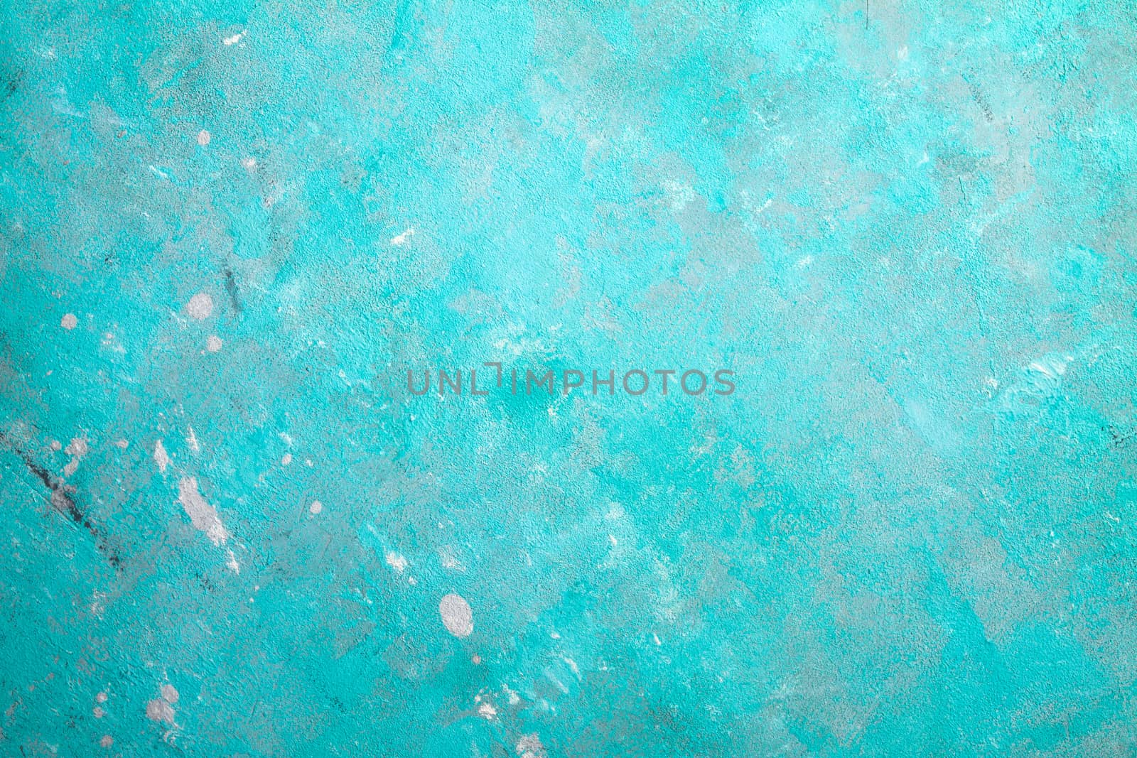 Concrete emerald green background with scuffs and black splashes. Textured wall texture in the grunge style.