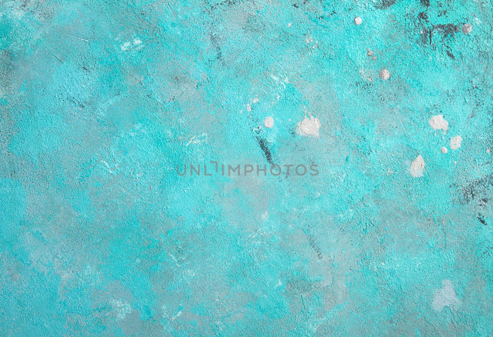 Concrete emerald green background with scuffs and black splashes. Textured wall texture in the grunge style.