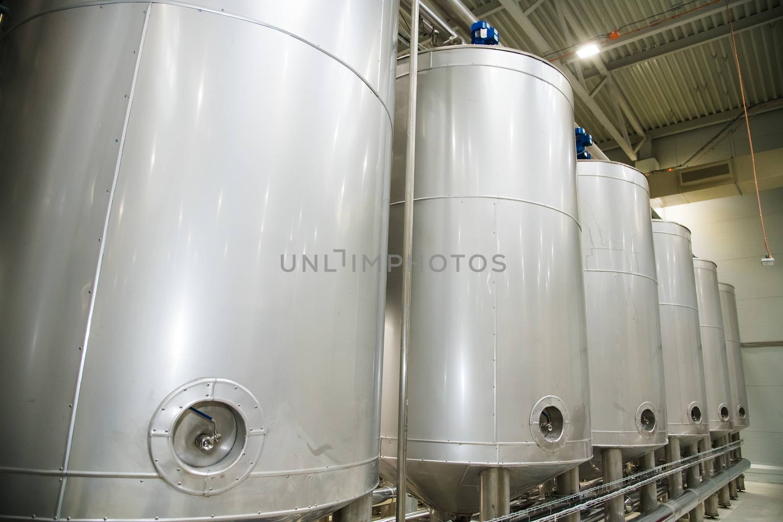 Grain processing facility inside. Industrial factory silos and equipment for food production