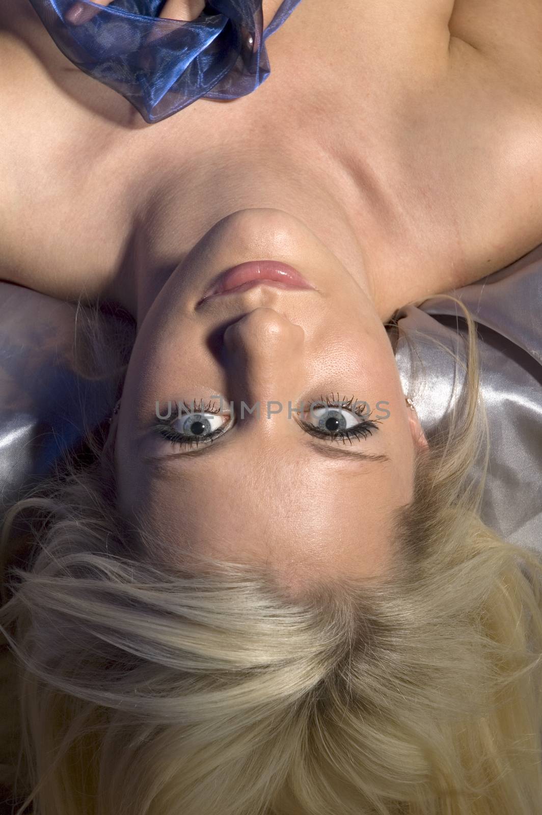 Upside down image of blonde woman's face