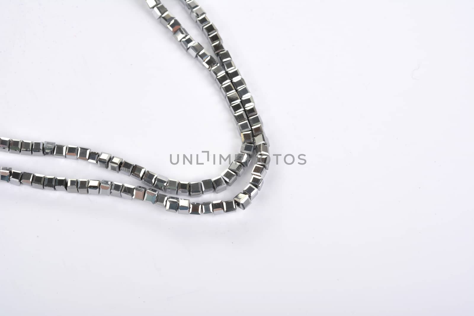 Beautiful color silver gray Glass Sparkle Crystal Isoalted Beads on white background. Use for diy beaded jewelry