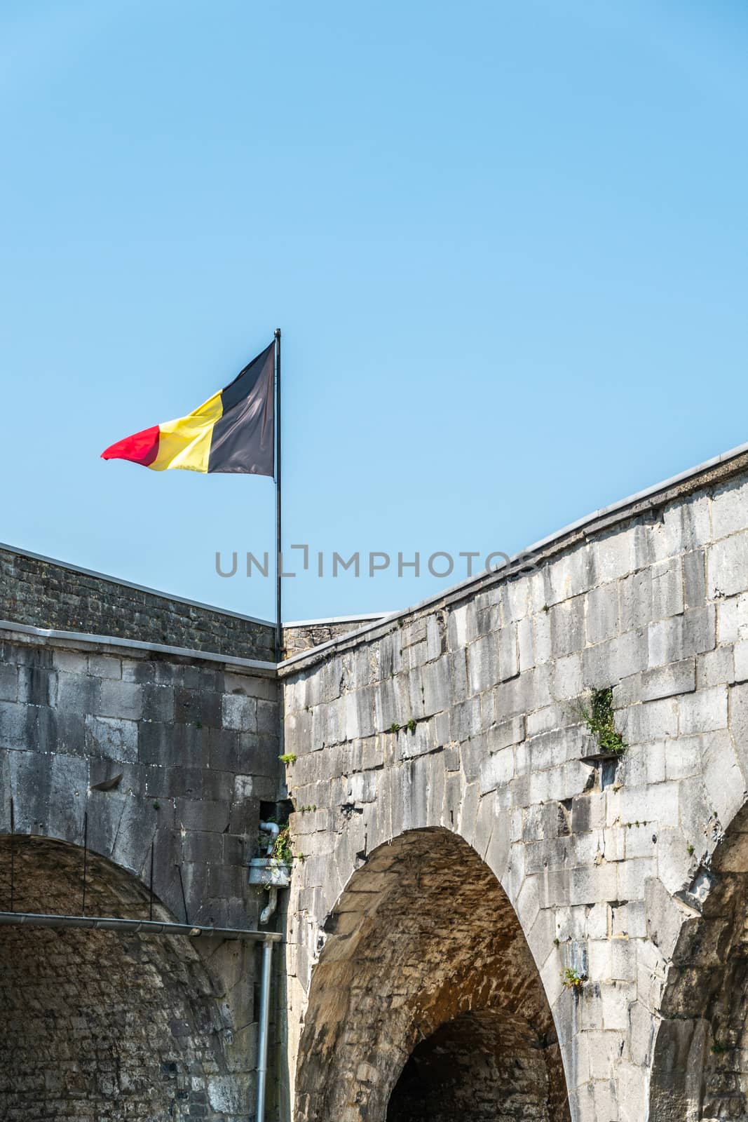 Belgian flag in Citadelle of Dinant, Belgium. by Claudine