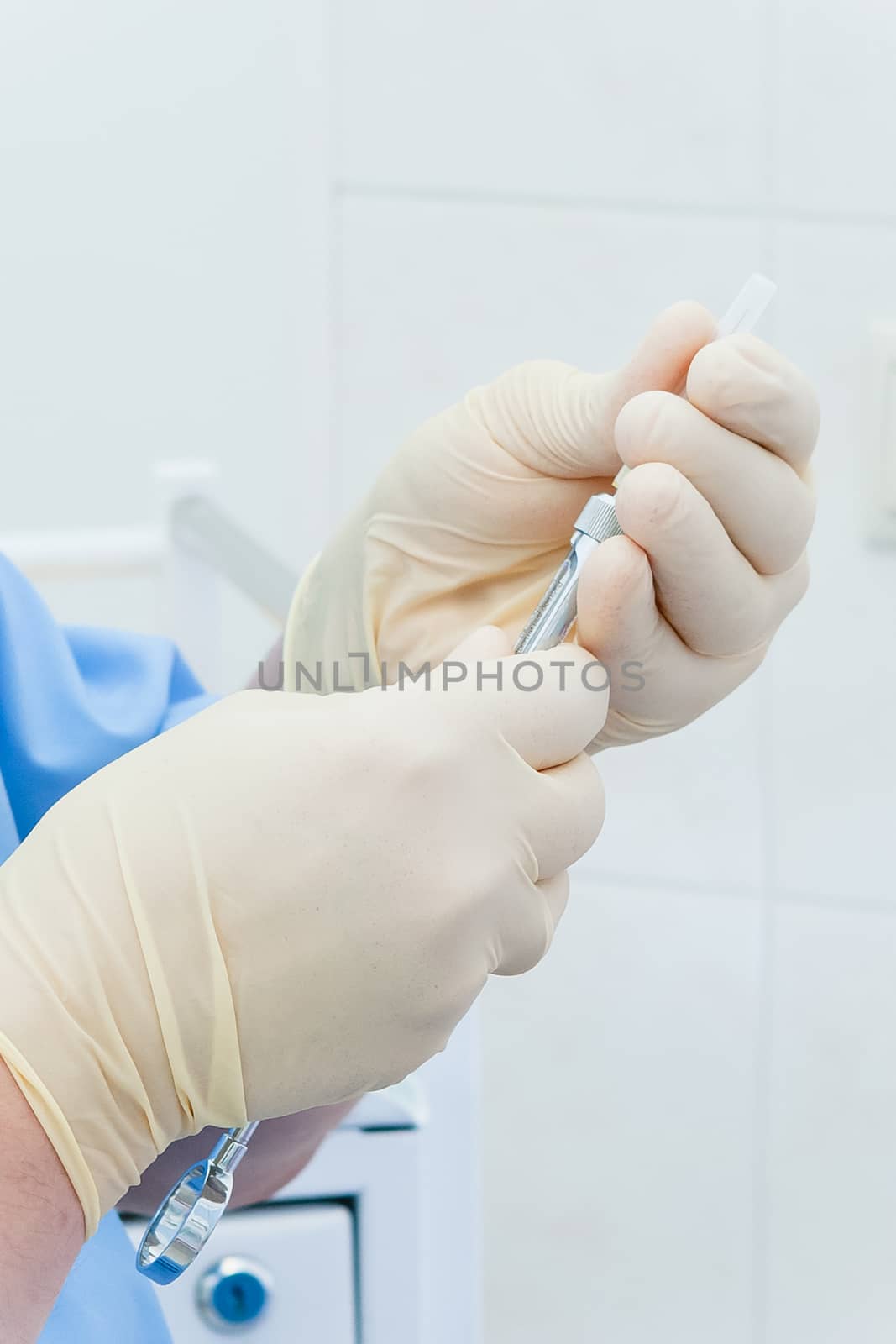 Hands in sterile gloves pick up medicine by SuperJStus