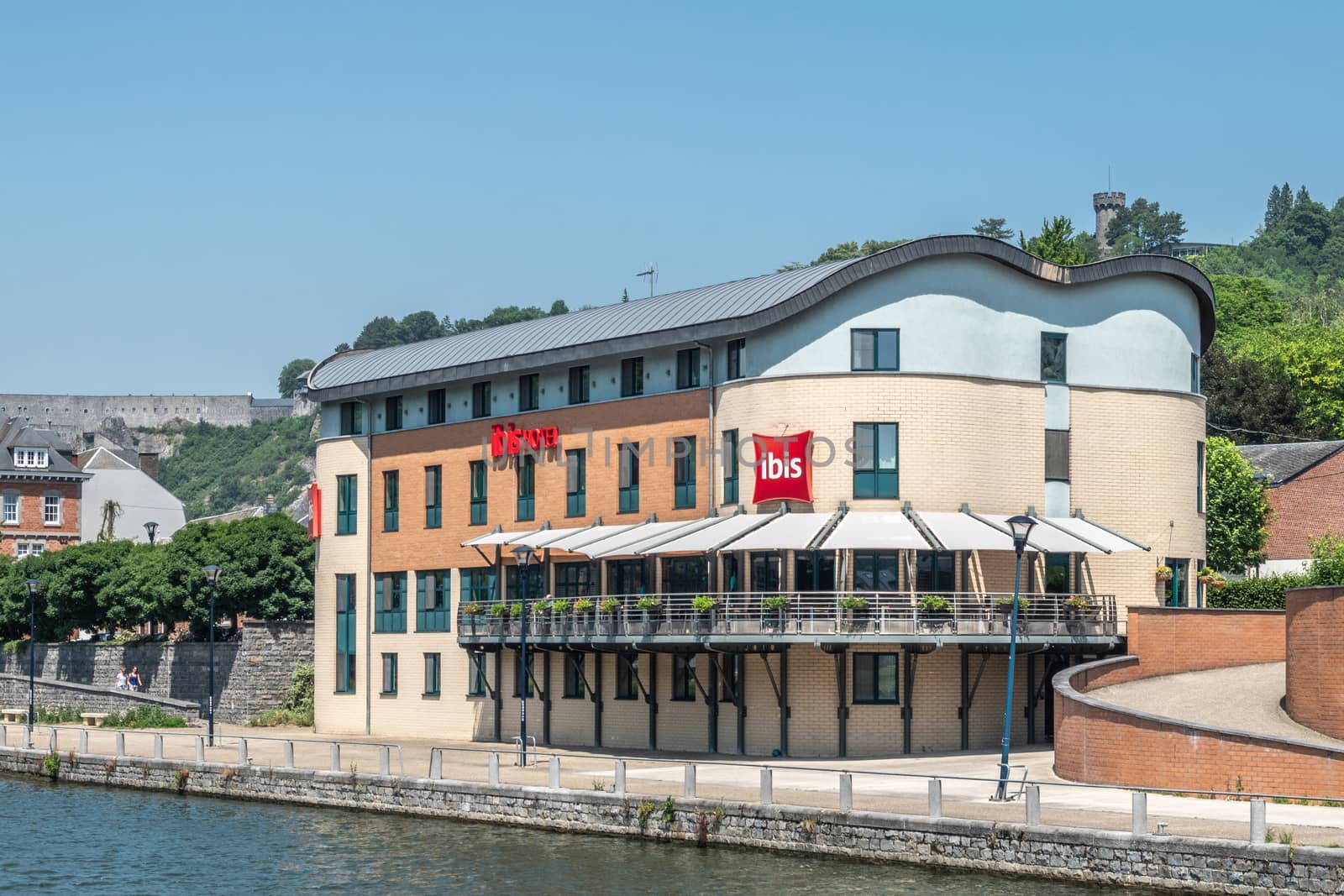 Ibis Hotel along Meuse River in Dinant, Belgium. by Claudine