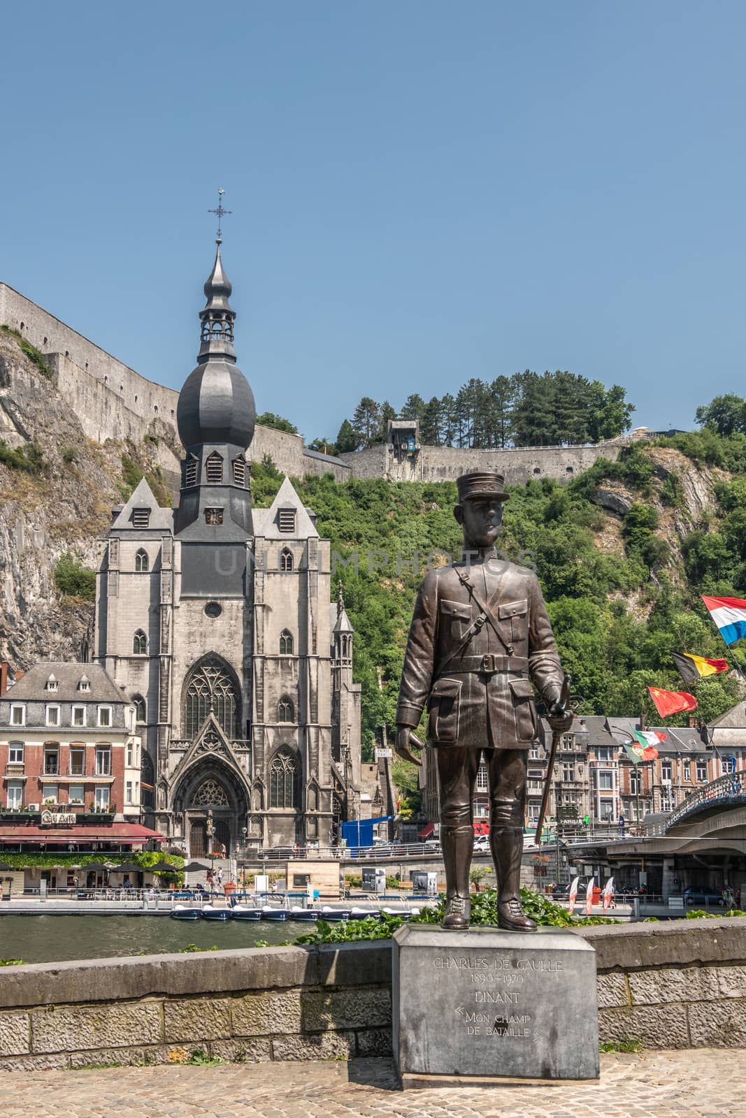 Notre Dame Church and Charles de Gaulle statue in Dinant, Belgiu by Claudine