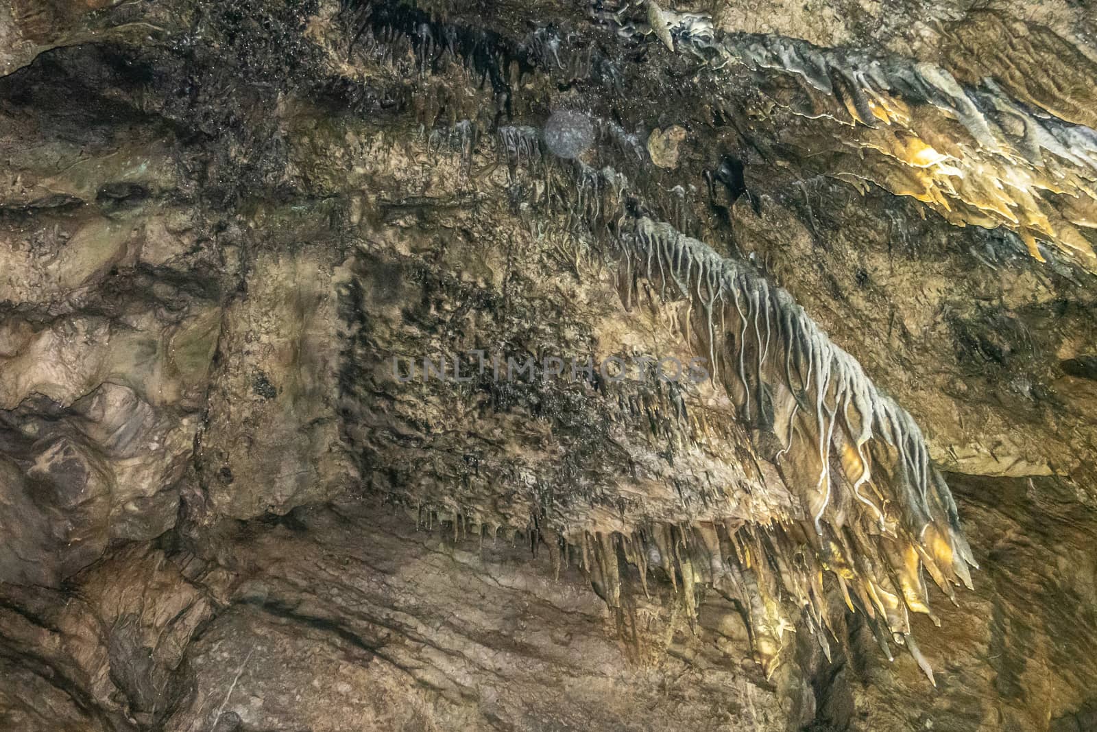 Han-sur-Lesse, Belgium - June 25, 2019: Grottes-de-Han 3 of 36. subterranean pictures of Stalagmites and stalactites in different shapes and colors throughout tunnels, caverns and large halls.