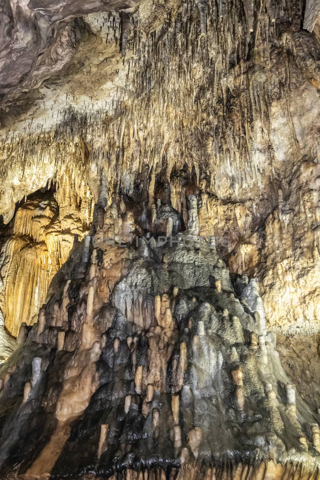Han-sur-Lesse, Belgium - June 25, 2019: Grottes-de-Han 18 of 36. subterranean pictures of Stalagmites and stalactites in different shapes and colors throughout tunnels, caverns and large halls..