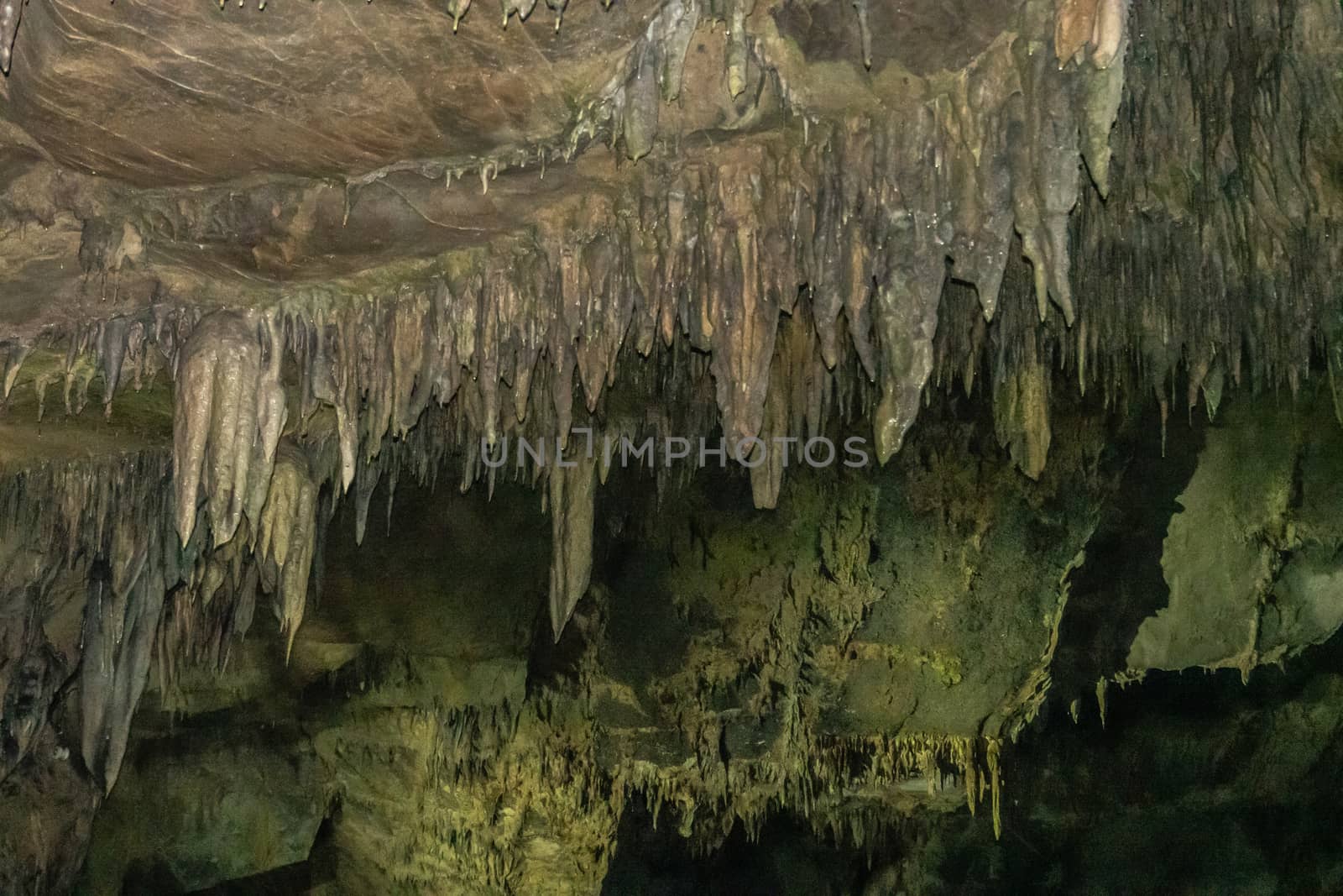 Han-sur-Lesse, Belgium - June 25, 2019: Grottes-de-Han 35 of 36. subterranean pictures of Stalagmites and stalactites in different shapes and colors throughout tunnels, caverns and large halls. Rock curtains.