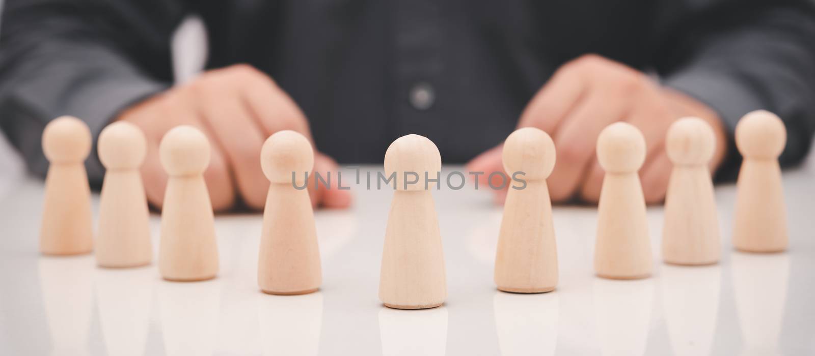 rows of wood cube people on business man background, promote leadership , business concept