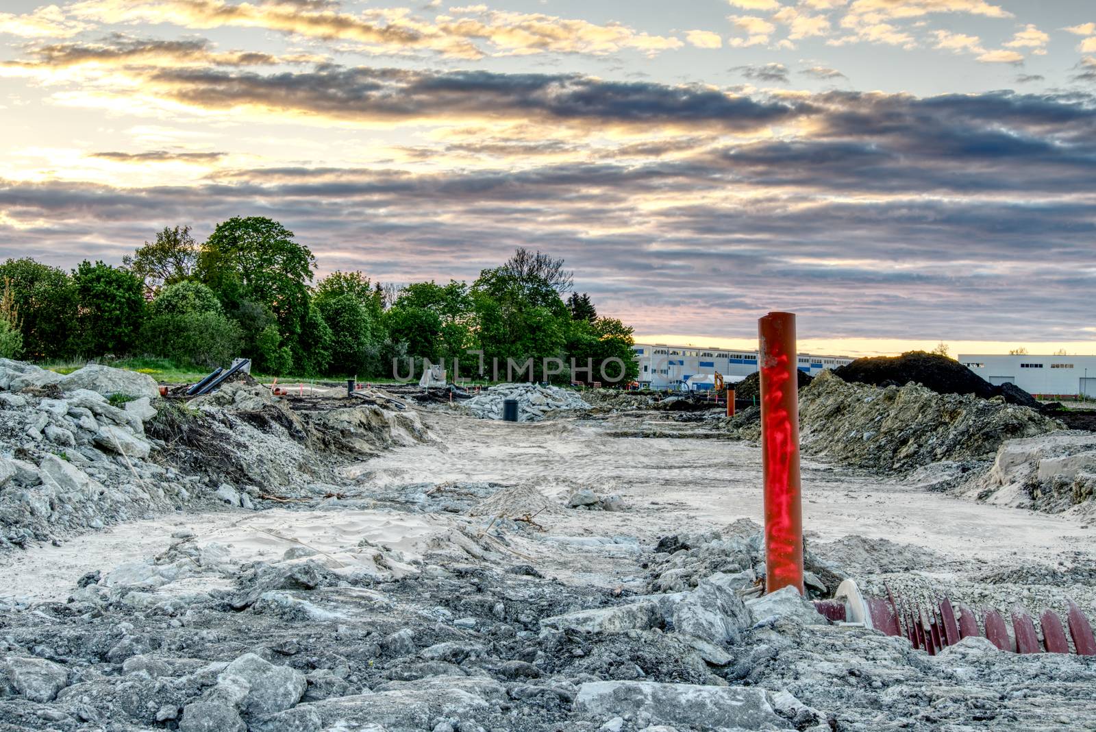 construction of a new residential quarter. laying communications and building roads in the field. by PhotoTime
